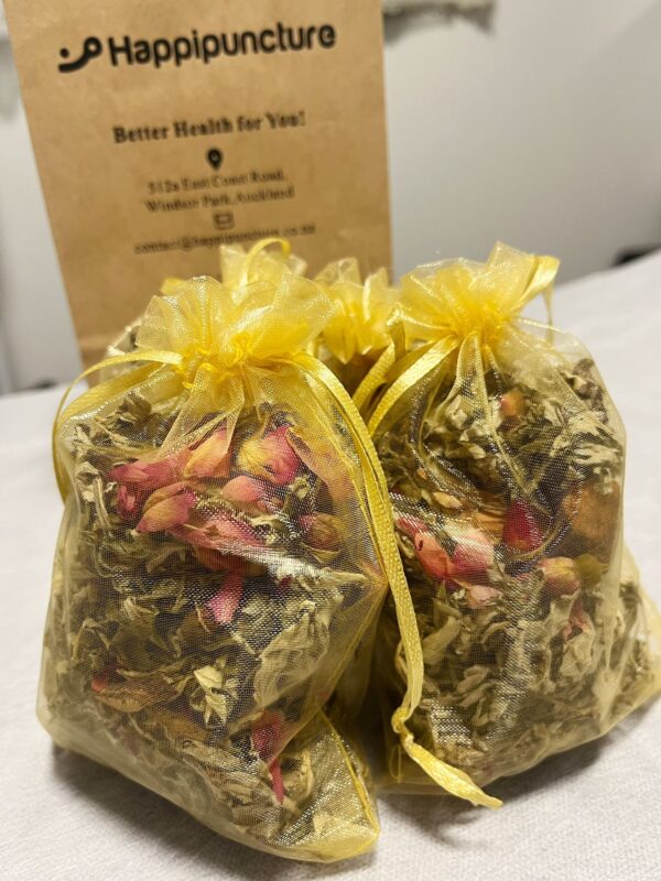 a mesh bag containing herbal blend for winter foot bath