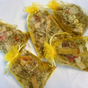 A mesh bag filled with herbal blend for a refreshing summer foot bath.